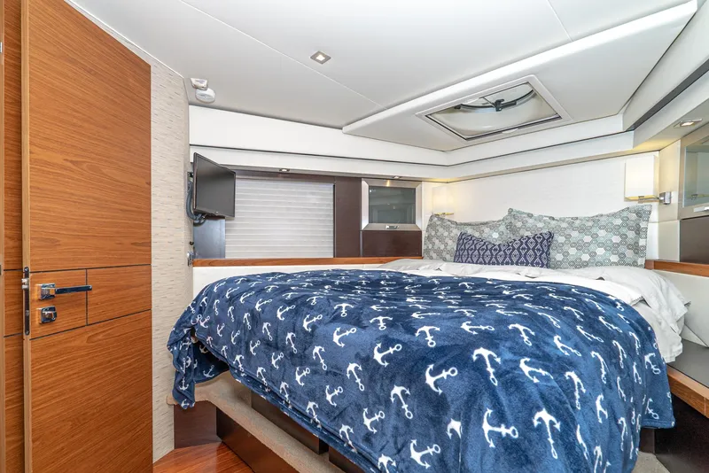 Slide: The Image of Luxurious bedroom in a 2017 Tiara Yachts C53 Coupe. - 30