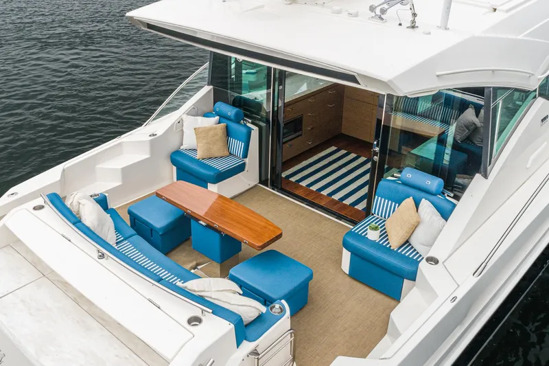 Slide: The Image of Luxurious outdoor seating on 2017 Tiara Yachts C53 Coupe by the water. - 33