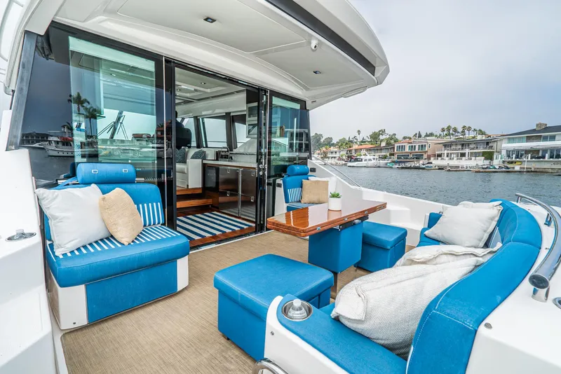 Slide: The Image of Luxurious interior of 2017 Tiara Yachts C53 Coupe with blue seating area. - 34