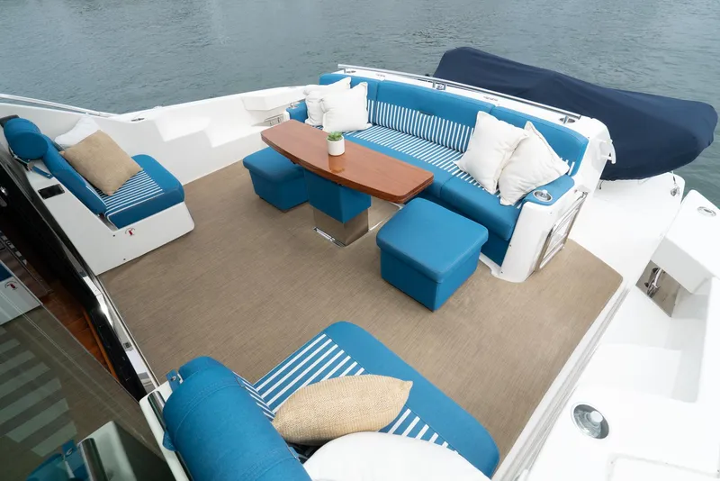 Slide: The Image of Luxurious outdoor seating on 2017 Tiara Yachts C53 Coupe with blue cushions. - 36