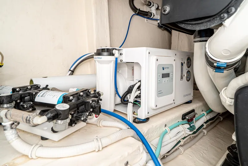 Slide: The Image of Engine room of 2017 Tiara Yachts C53 Coupe with water filtration system. - 41