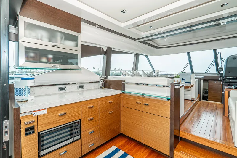 Slide: The Image of Interior of 2017 Tiara Yachts C53 Coupe featuring modern kitchen. - 7