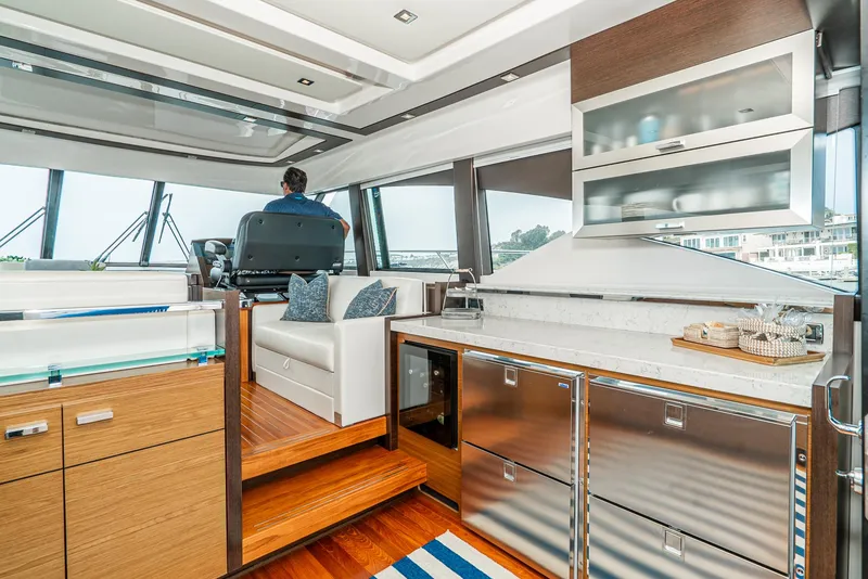 Slide: The Image of Interior of 2017 Tiara Yachts C53 Coupe with modern kitchen. - 9
