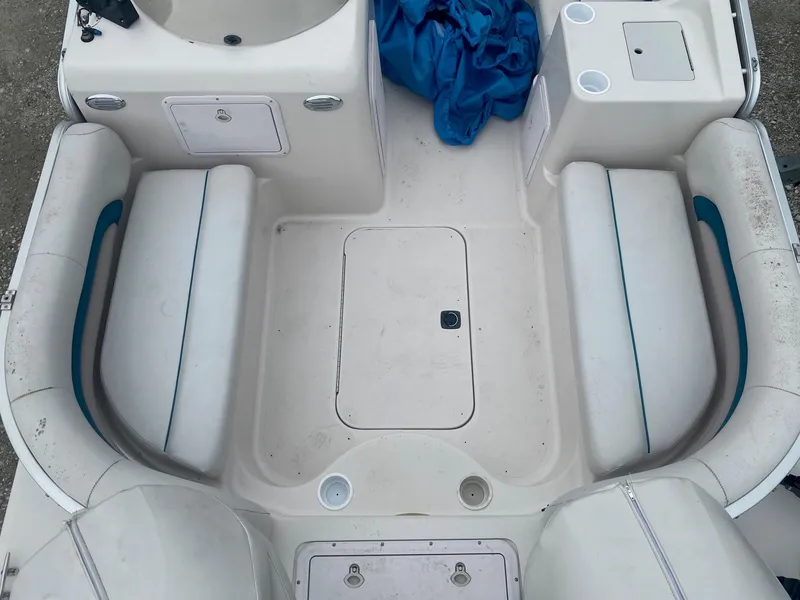 Slide: The Image of 2001 Hurricane 198R boat interior with white seating and storage compartments. - 4
