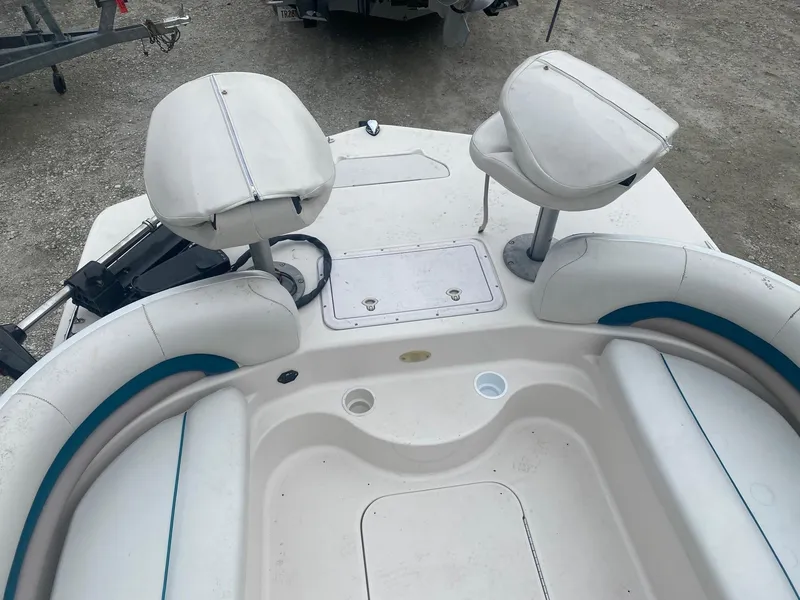 Slide: The Image of 2001 Hurricane 198R boat interior with seating and storage compartments. - 8