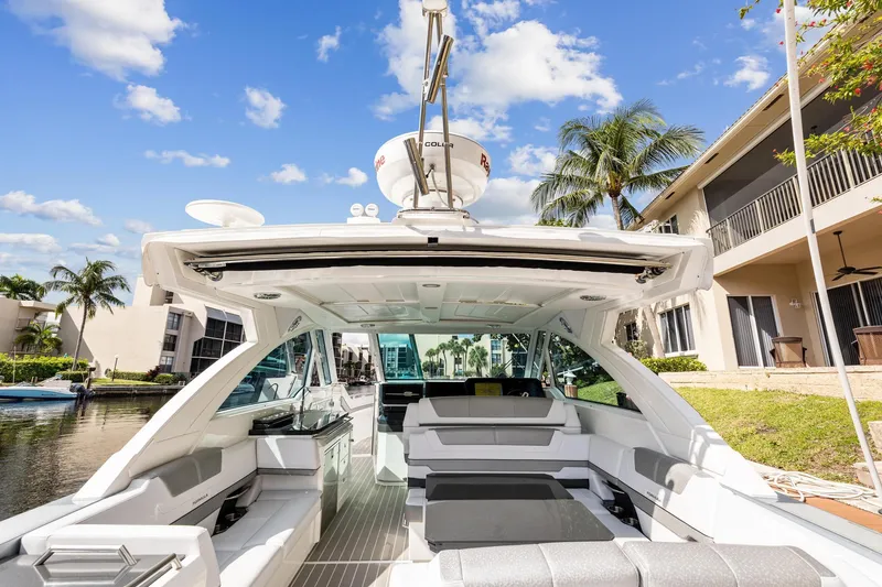 Slide: The Image of 2021 Formula 380 Super Sport Crossover OB on a sunny waterway. - 15