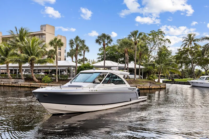 Slide: The Image of 2021 Formula 380 Super Sport Crossover OB on a sunny waterway. - 3