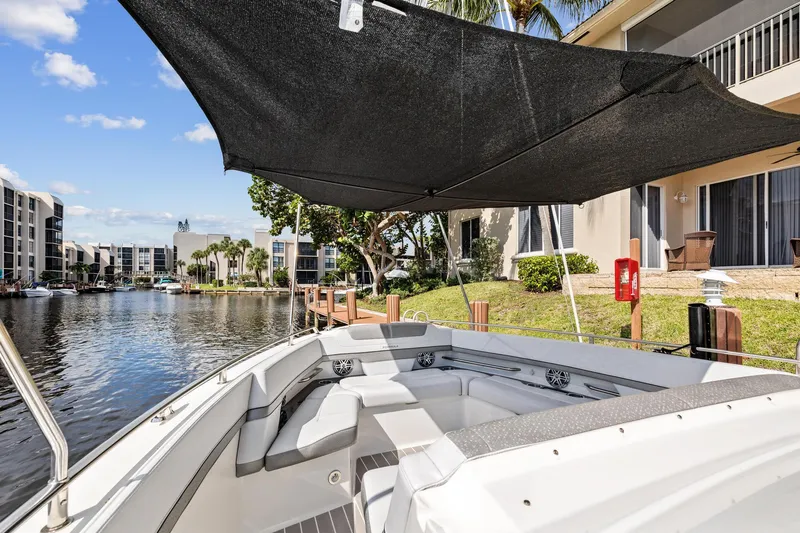 Slide: The Image of 2021 Formula 380 Super Sport Crossover OB by the water, with sunshade. - 5