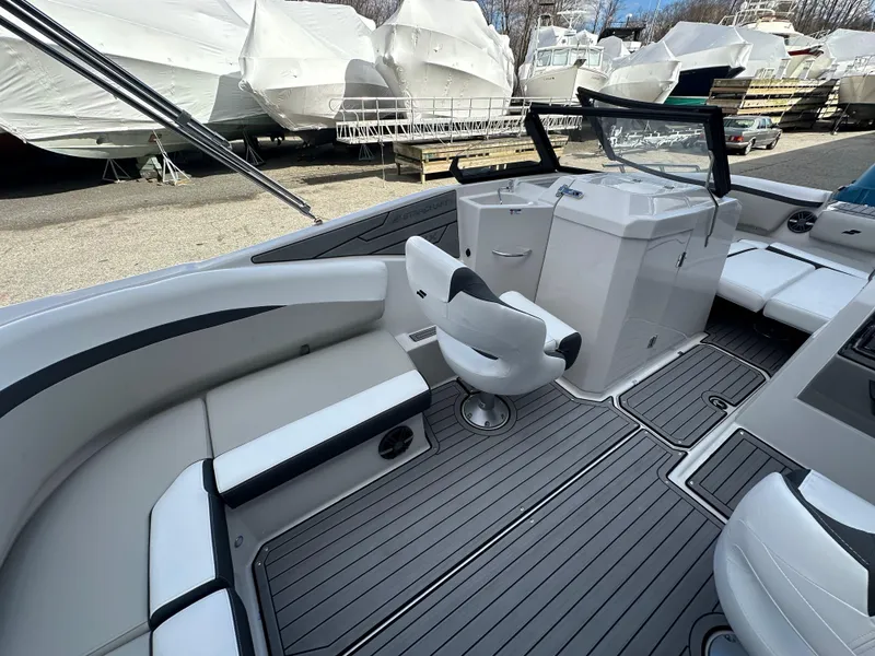 Slide: The Image of 2024 Starcraft SVX 230 OB boat dashboard with steering wheel and gauges. - 16