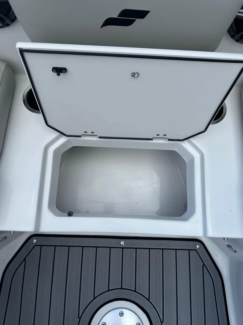 Slide: The Image of 2024 Starcraft SVX 230 OB boat interior with seating and storage compartments. - 27