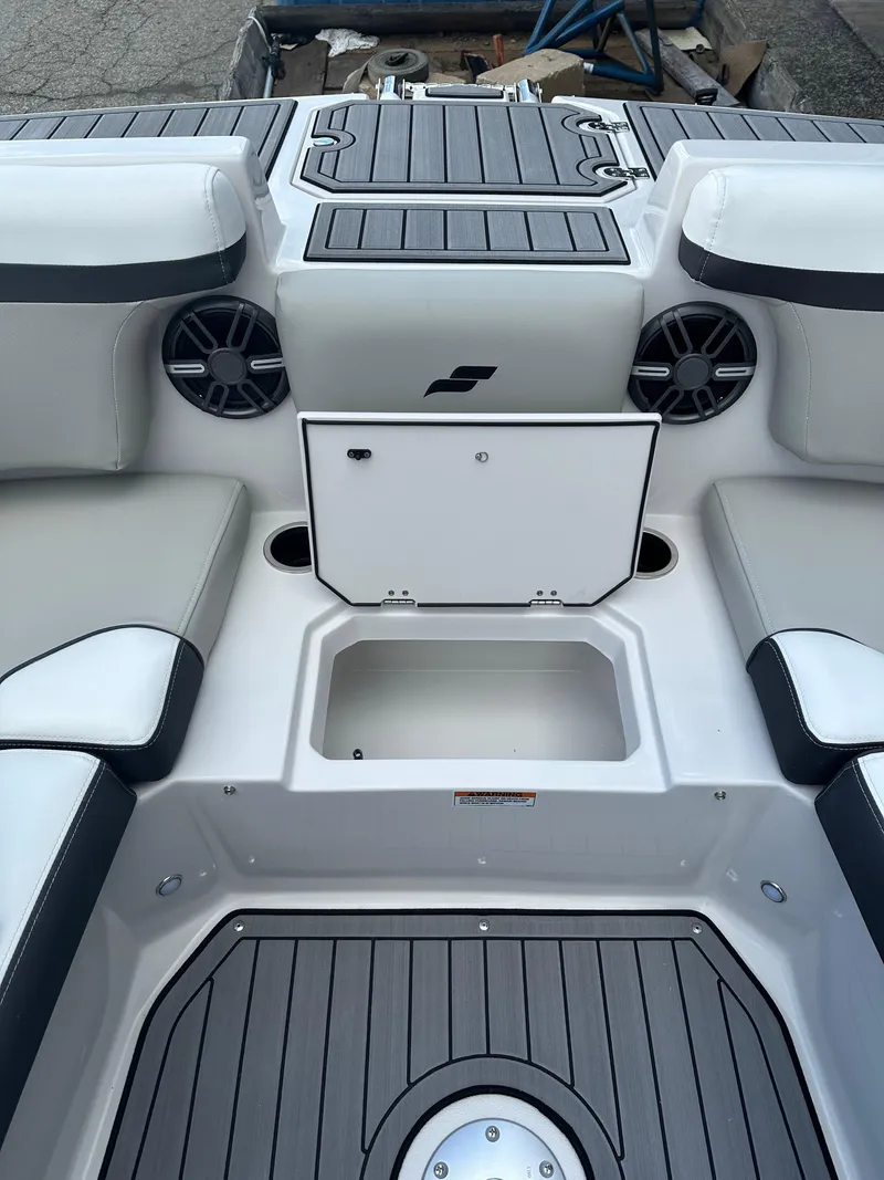 Slide: The Image of 2024 Starcraft SVX 230 OB boat storage compartment with open hatch. - 28