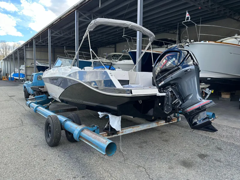 Slide: The Image of 2024 Starcraft SVX 230 OB boat on trailer in marina storage. - 7