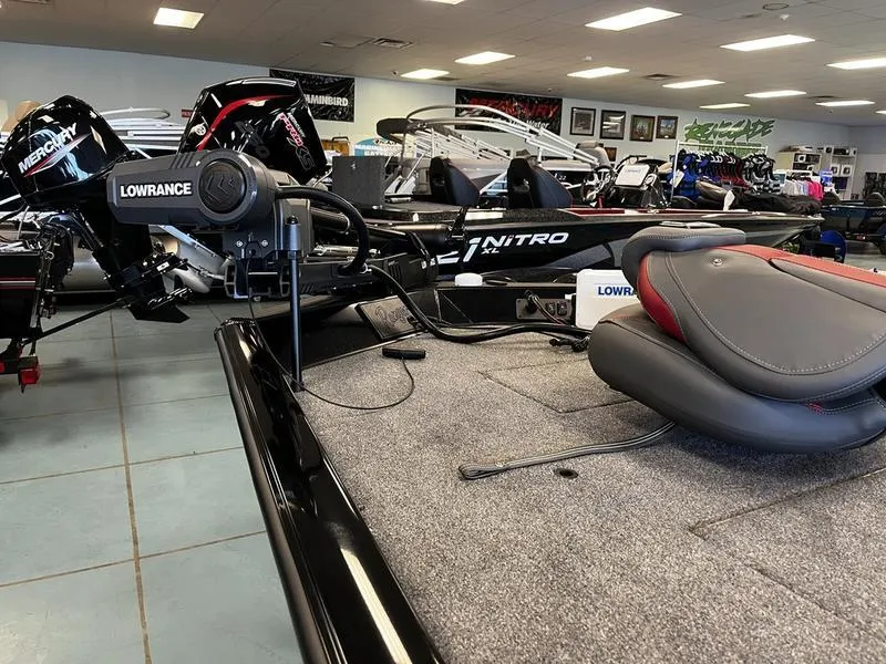 Slide: The Image of 2024 Ranger RT188C fishing boat interior with Lowrance electronics and Mercury outboard motor. - 2