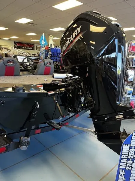 Slide: The Image of 2024 Ranger RT188C boat with Mercury outboard motor in showroom. - 3