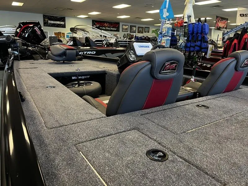 Slide: The Image of 2024 Ranger RT188C fishing boat interior with seating and storage compartments. - 4