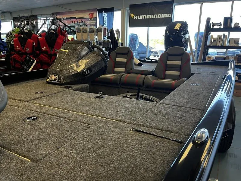 Slide: The Image of 2024 Ranger RT188C fishing boat interior with seats and storage compartments. - 5