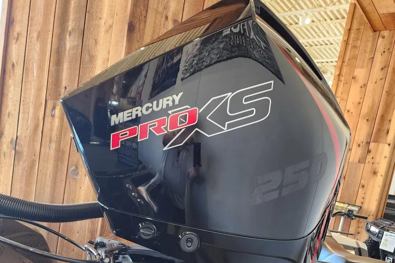 Slide: The Image of 2024 Ranger Z520R boat with Minn Kota Ultrex trolling motor in a workshop setting. - 3