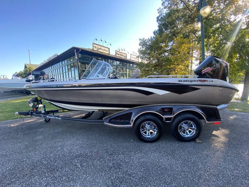 The Image of 2024 Ranger 620FS Ranger Cup Equipped boat on a trailer, parked outdoors. - 0