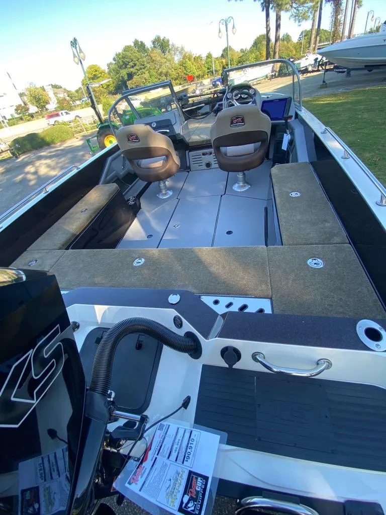 Slide: The Image of 2024 Ranger 620FS Ranger Cup Equipped fishing boat interior with seating and storage compartments. - 3