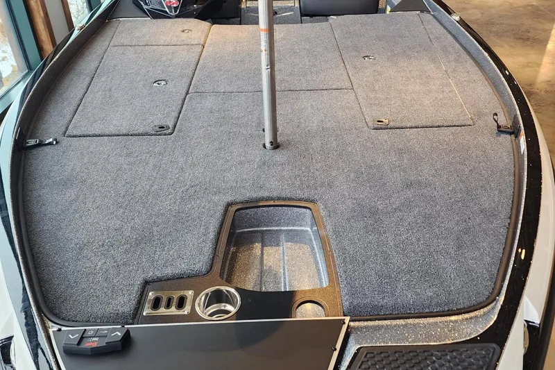 Slide: The Image of 2024 Ranger Z521R boat deck with storage compartments and cup holder. - 3