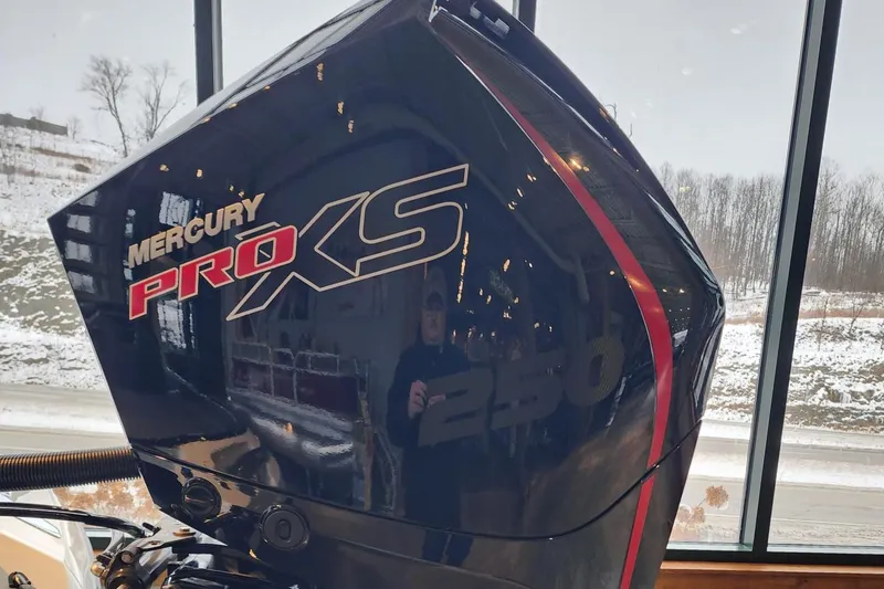 Slide: The Image of 2024 Ranger Z521R with Mercury Pro XS 250 engine, displayed indoors. - 4