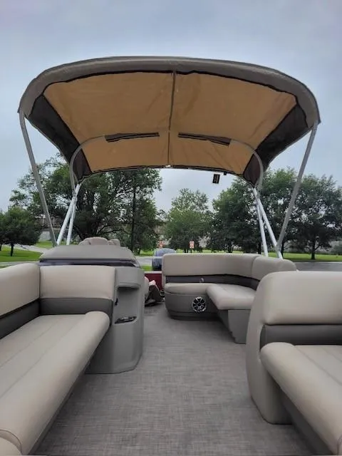Slide: The Image of 2024 Sun Tracker Party Barge 18 DLX interior with canopy and seating. - 4