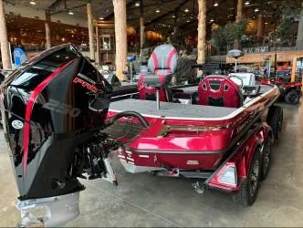 Slide: The Image of 2024 Ranger Z520R Ranger Cup Equipped boat in showroom, featuring powerful engine and sleek design. - 2