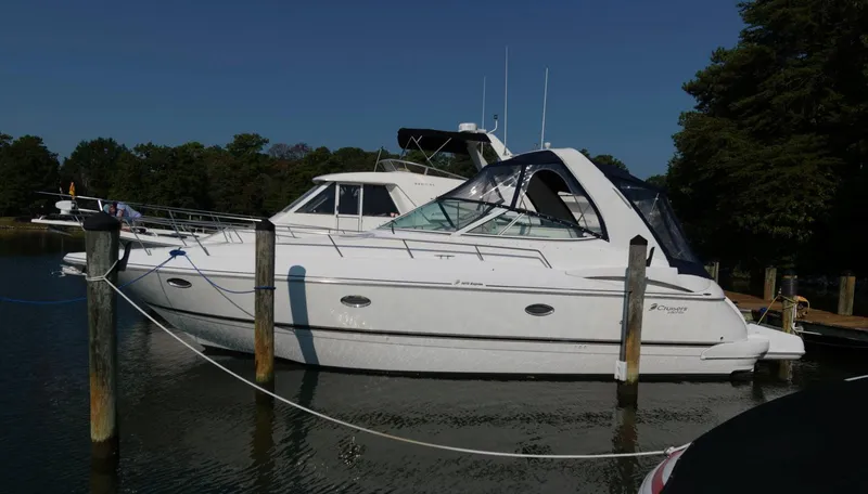 Slide: The Image of 2000 Cruisers Yachts 3672 Express docked in a marina. - 1