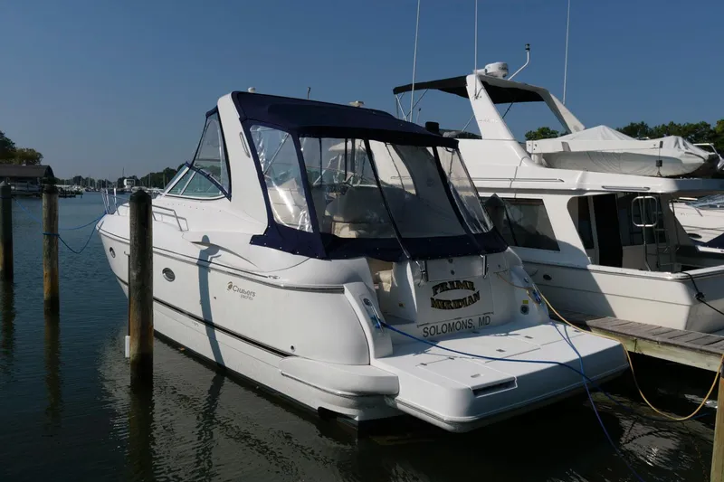 Slide: The Image of 2000 Cruisers Yachts 3672 Express docked at a marina in Solomons, MD. - 2