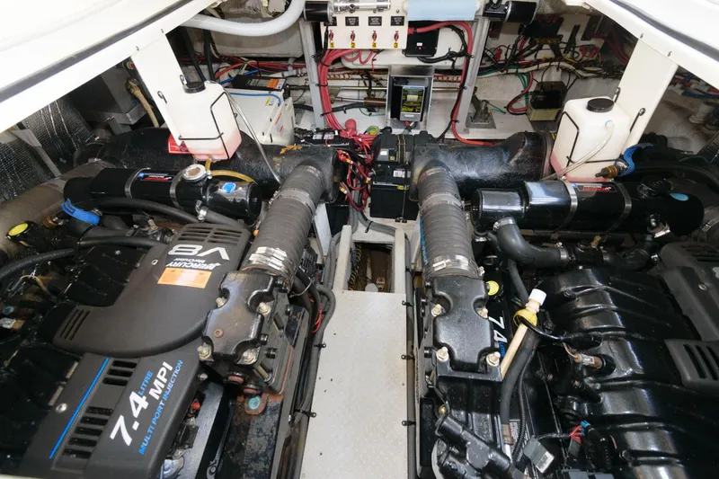 Slide: The Image of Engine room of a 2000 Cruisers Yachts 3672 Express with twin 7.4 MPI engines. - 19