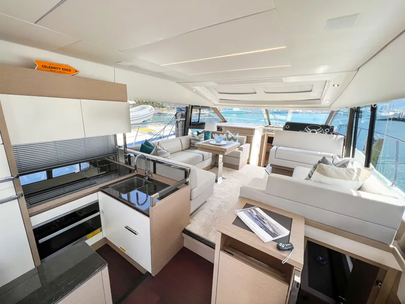 Slide: The Image of Luxurious interior of a 2020 Prestige 520 S yacht with modern furnishings and panoramic windows. - 11