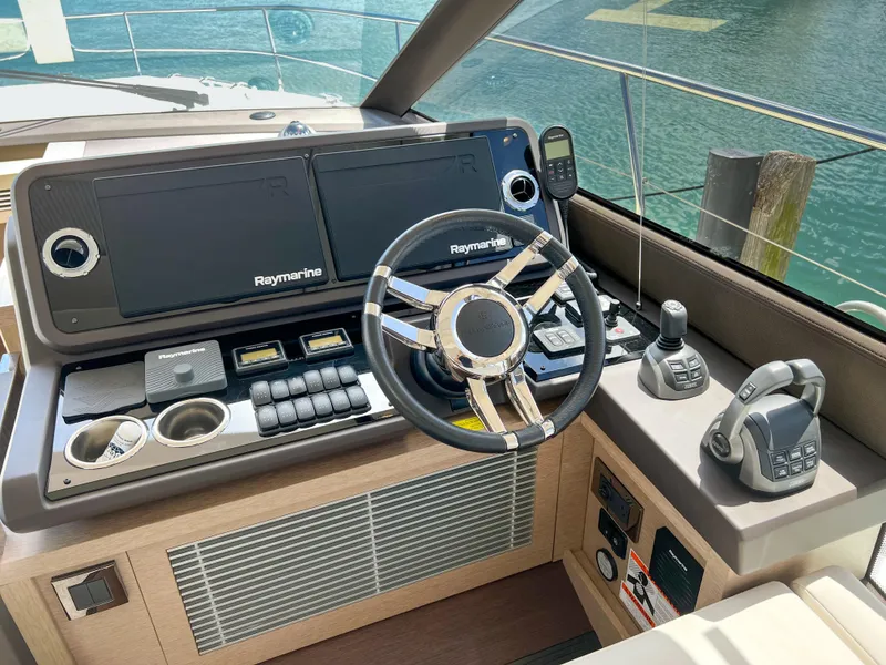 Slide: The Image of Prestige 520 S 2020 yacht helm station with Raymarine electronics and modern controls. - 14