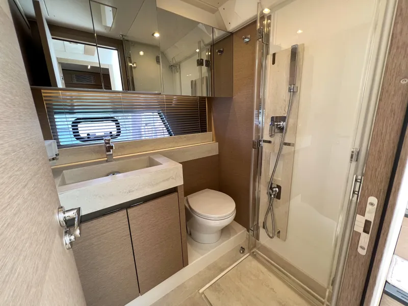 Slide: The Image of Modern bathroom in a 2020 Prestige 520 S yacht with shower, sink, and toilet. - 19