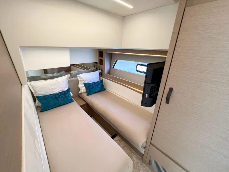 Slide: The Image of Interior cabin of 2020 Prestige 520 S yacht with twin beds and modern decor. - 20