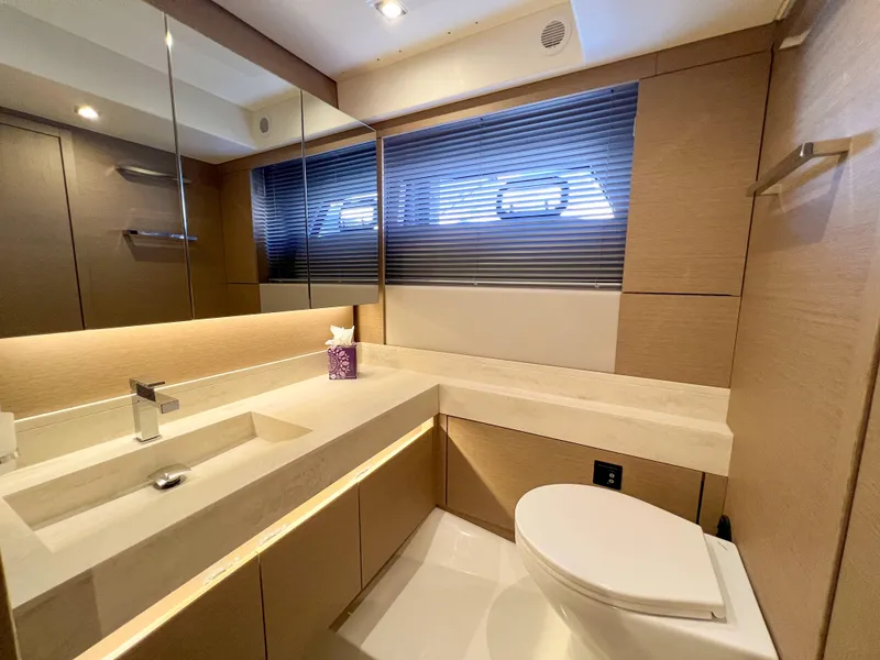 Slide: The Image of Modern bathroom in a 2020 Prestige 520 S yacht with sleek fixtures and ample lighting. - 22
