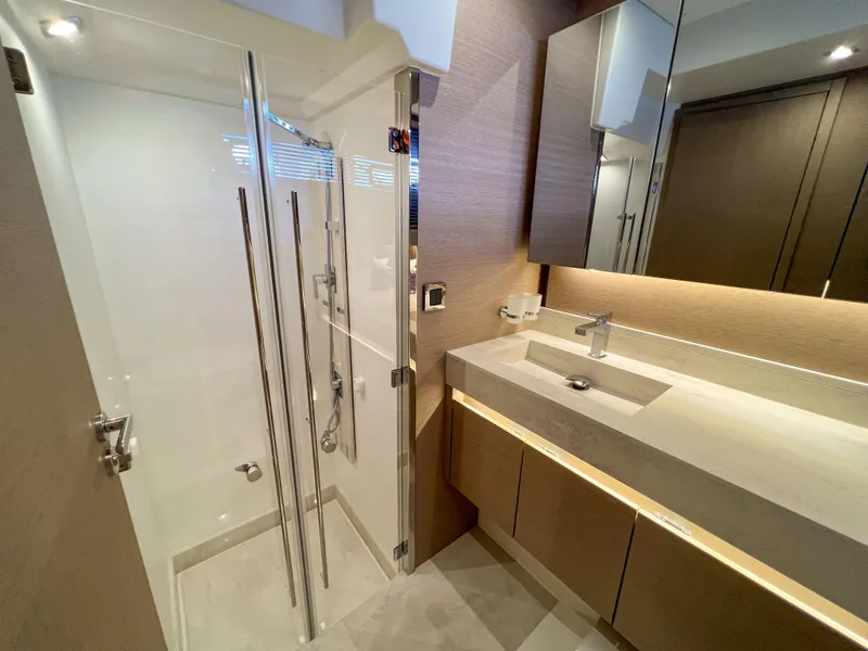Slide: The Image of Modern bathroom in a 2020 Prestige 520 S yacht with glass shower and sleek vanity. - 23