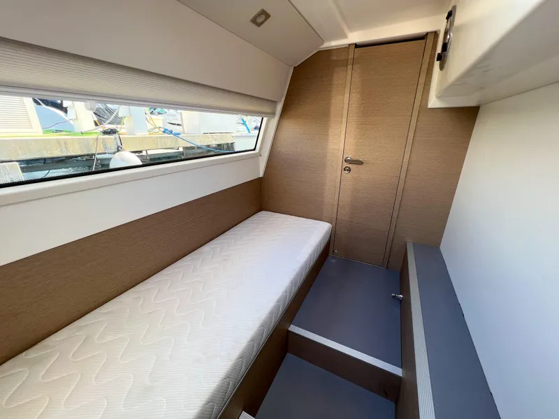 Slide: The Image of Interior cabin of 2020 Prestige 520 S yacht with single bed and window. - 6
