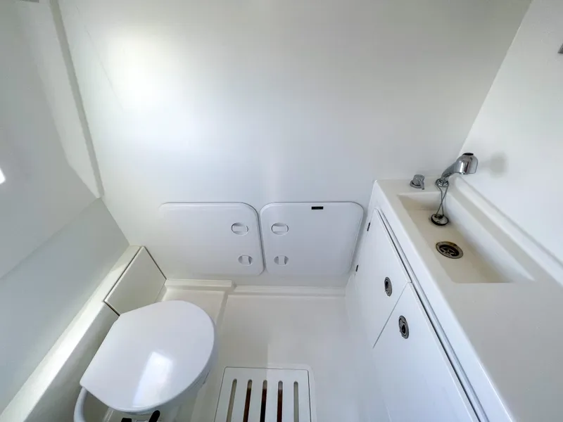 Slide: The Image of 2020 Prestige 520 S yacht bathroom with white fixtures and modern design. - 7