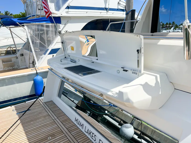 Slide: The Image of Prestige 520 S 2020 yacht with outdoor kitchen at Miami Lakes dock. - 8
