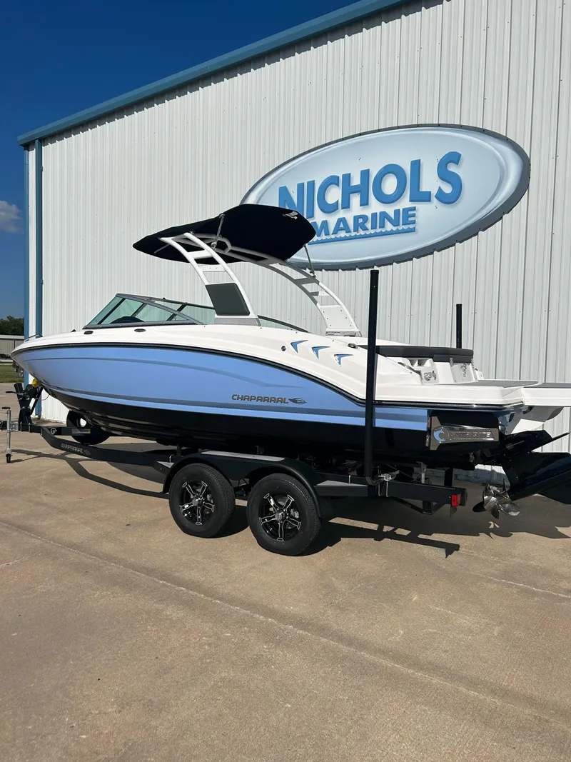 Slide: The Image of 2024 Chaparral 23 Surf boat on trailer at Nichols Marine dealership. - 3