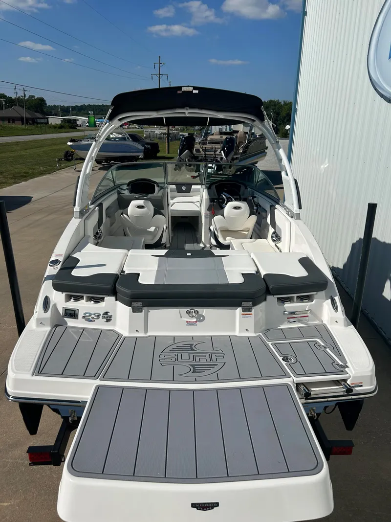 Slide: The Image of 2024 Chaparral 23 Surf boat with spacious deck and modern seating. - 4