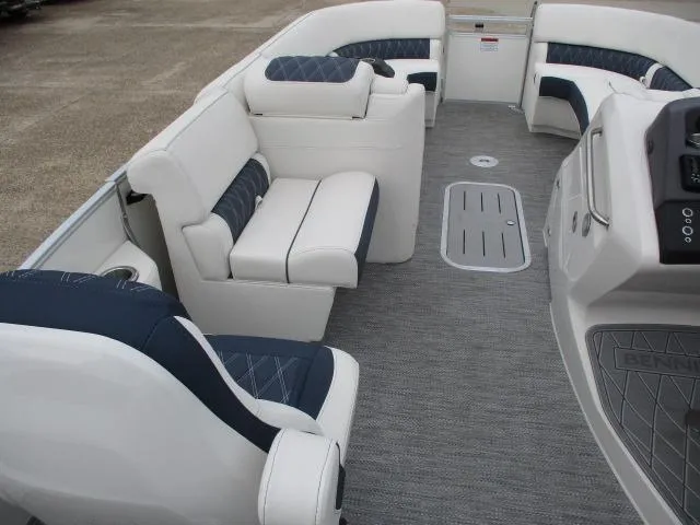 Slide: The Image of 2023 Bennington 25QFBA pontoon boat interior with plush seating and modern design. - 11