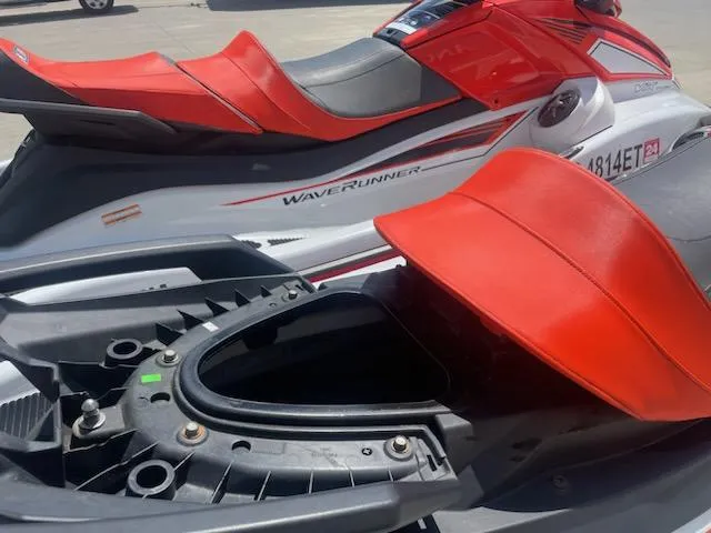 Slide: The Image of 2021 Yamaha WaveRunner VX Cruiser with red seats and open storage compartment. - 12