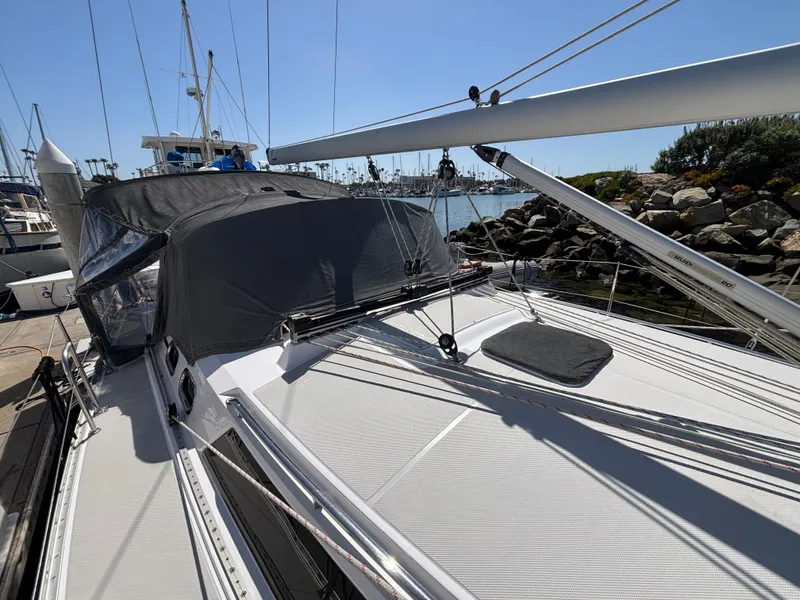 Slide: The Image of 2019 Catalina 385 sailboat docked, featuring sleek deck design and modern rigging. - 12