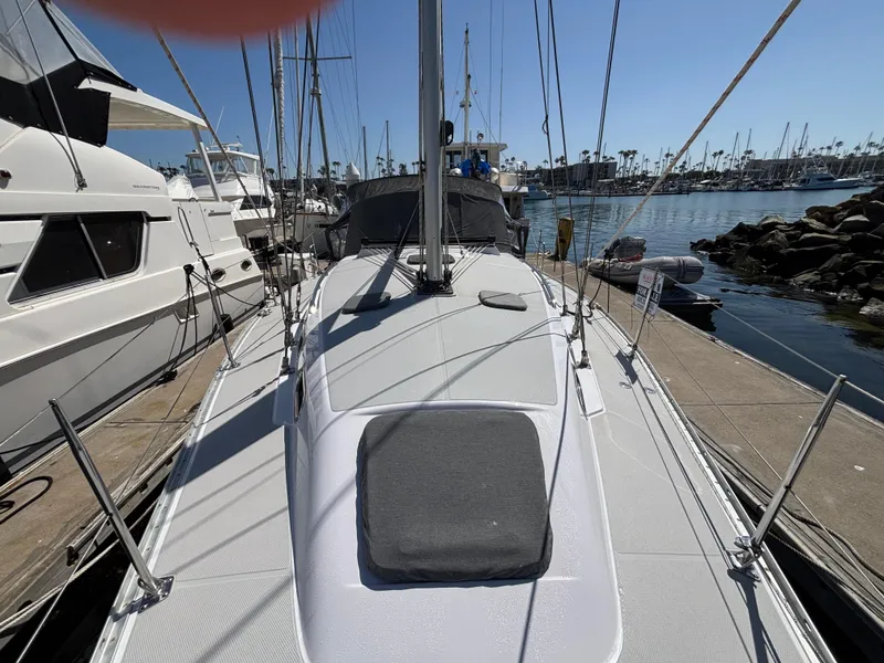 Slide: The Image of 2019 Catalina 385 sailboat docked at a marina, surrounded by other boats. - 14