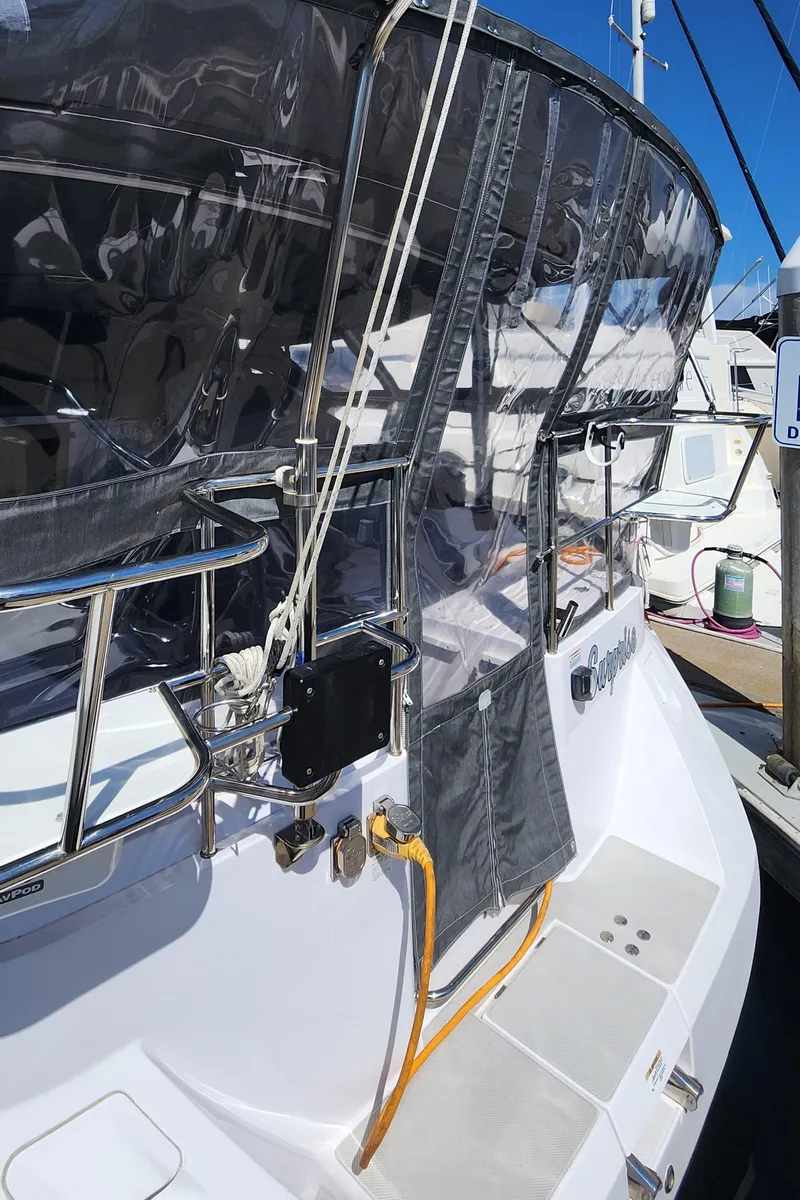 Slide: The Image of 2019 Catalina 385 sailboat docked, featuring sleek design and modern fittings. - 18