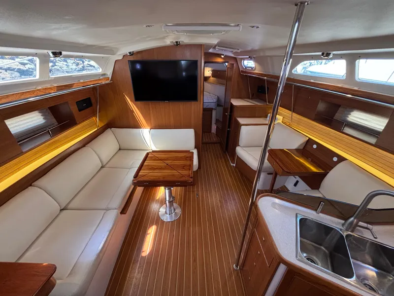 Slide: The Image of Luxurious interior of a 2019 Catalina 385 sailboat with modern amenities and elegant wood finishes. - 19
