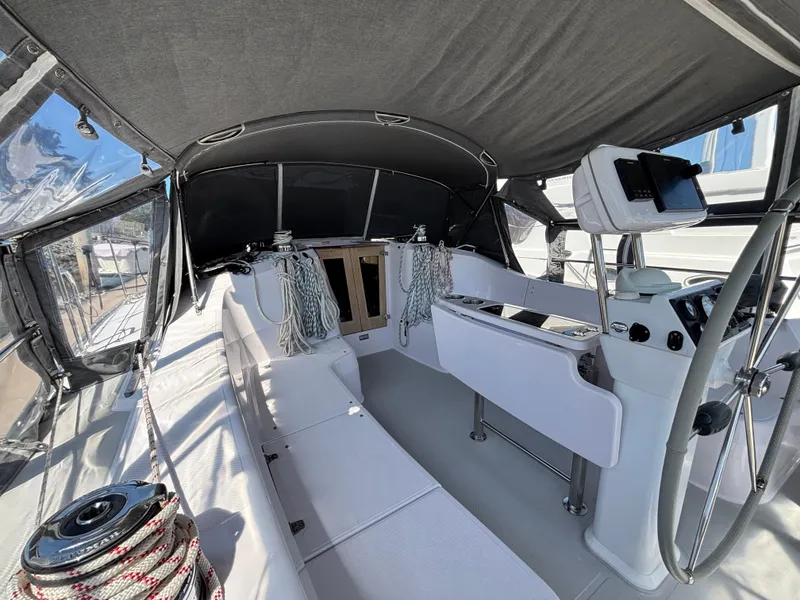 Slide: The Image of 2019 Catalina 385 sailboat cockpit with modern navigation equipment and seating. - 2