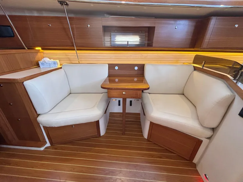 Slide: The Image of Interior of 2019 Catalina 385 yacht with cozy seating and wooden accents. - 22