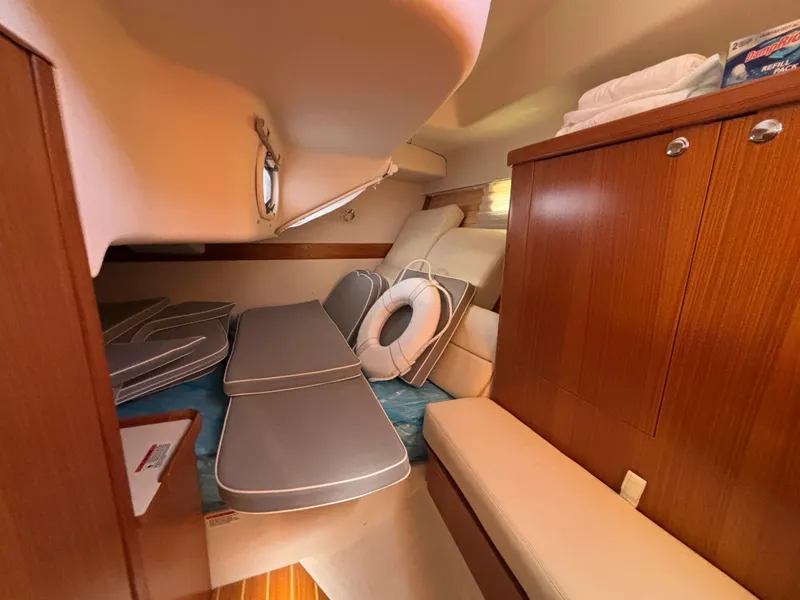 Slide: The Image of 2019 Catalina 385 yacht interior with wooden cabinets and cushioned seating. - 30